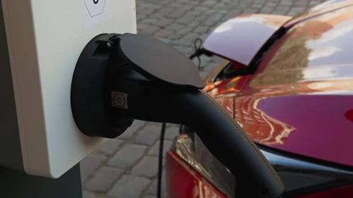Electric Car Charging at Public Stations in Urban Areas Promotes Green Energy and Ecofriendly