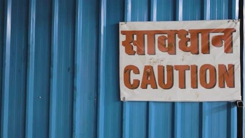 caution signboard at construction site at evening