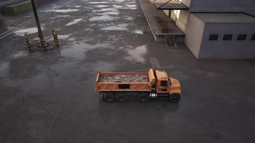 Dump Truck Parked Next to Building in Parking Lot