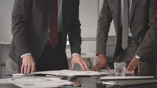 Cropped Businessmen Working on Project in Office
