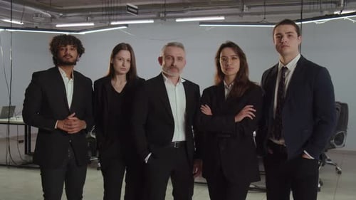 Group Photo of People in Business Suits A Team of Successful Entrepreneurs Pose Against the Backdrop