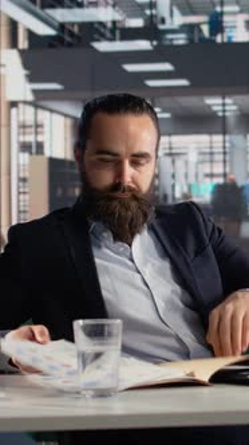 Vertical Video Business Leader Planning Development Strategy with Performance Metrics
