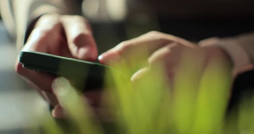Close Up Hands Typing on Mobile Phone