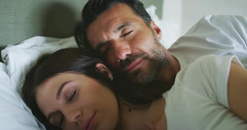 Authentic close up shot of married couple in love embracing and caressing each other with affectio