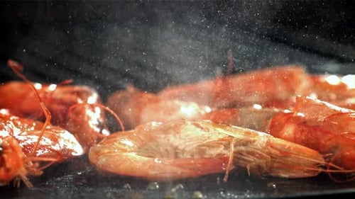 The Shrimp is Fried in a Pan with a Splash Filmed on a Highspeed Camera at 1000 Fps