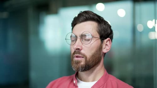 Close up portrait of mature business man freelancer relaxing alone during break at workplace Smiling