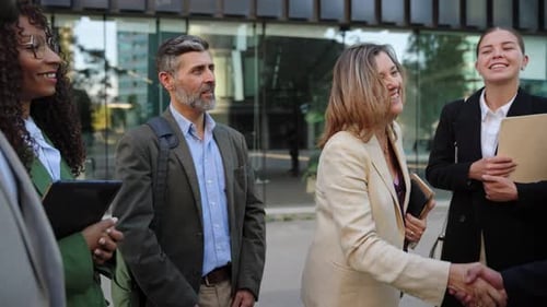 Business Woman Shaking Hands to Celebrate Agreement Deal Together with Company Team in the Office