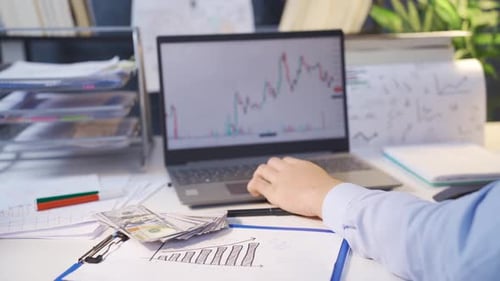 Man making financial transactions on the stock market.
