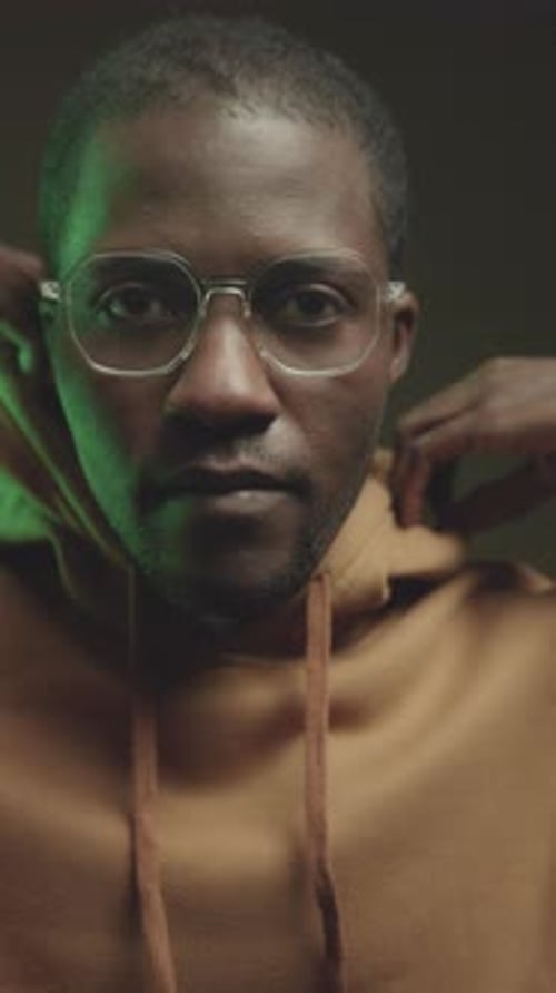 Vertical Portrait of Male Programmer in Hood