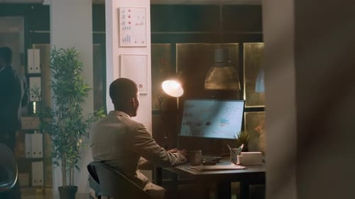 Employee Enjoys Coffee During Nightshift