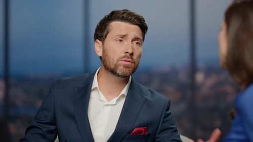 Television Program Guest Talking to Anchorwoman Sharing Sad Story Studio Closeup