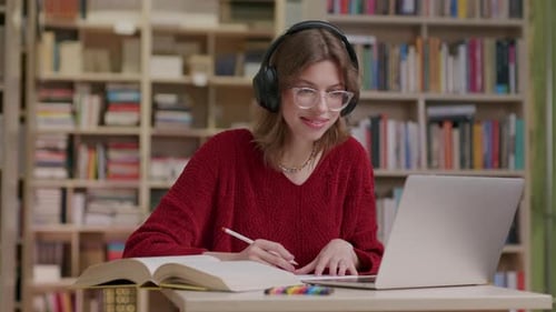 Teenager Studying In Library