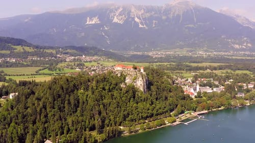 Aerial footage of Medieval Bled Castle overlooking the lake, Slovenia.