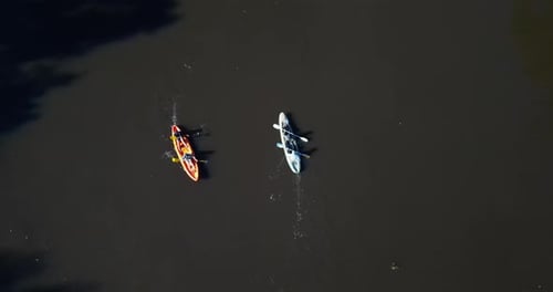 Aerial view, kayak and people on lake water with sport and outdoor adventure on a river