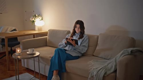Pensive Manager Holding Tablet at Night Remote Workplace Freelancer Working