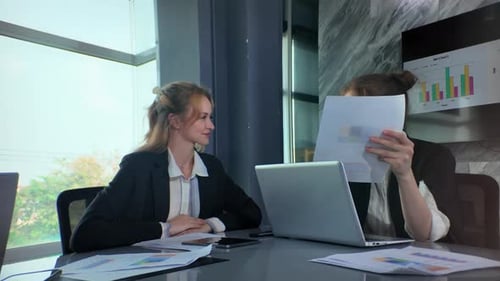 Women Collaborating in Modern Conference Room