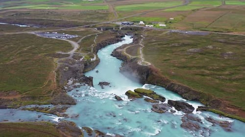 Aerial view of waterfall and river, Iceland.