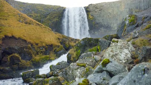 Waterfall in Iceland Mountain River with Pure Glacial Water
