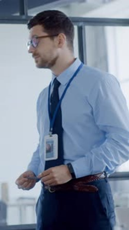 A Professional Man in Business Attire Diligently Working in a Modern Office Setting and Environment