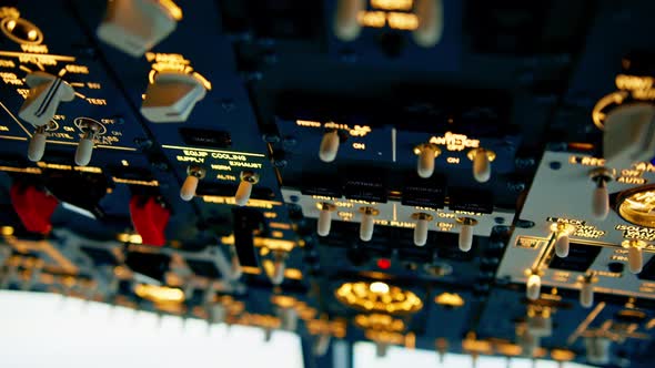 Close-up of the overhead panel of a modern airplane with buttons and ...