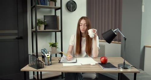 Ginger Hair Young Girl Studying at Home