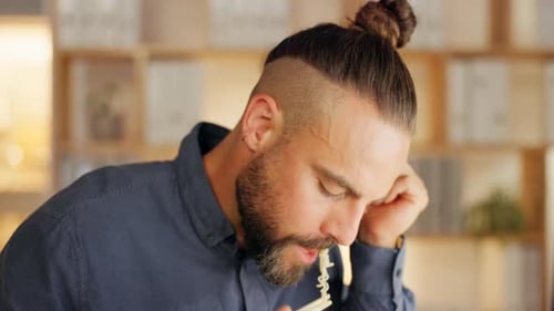 Night at office, man eating noodles at desk while working overtime on start up project at tech