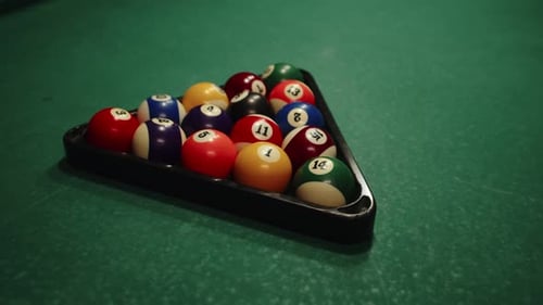Closeup of Billiard Balls in Triangular Shape on Table at Club Billiard Ball on Green Table in