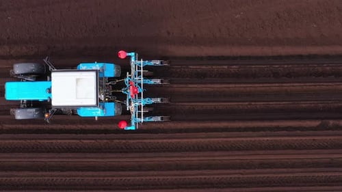 Tractor with Seeder in the Field