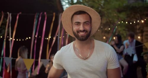 Close Up Face Athletic Young Man Poses to Camera Enjoying Cool Modern Music at Night Party
