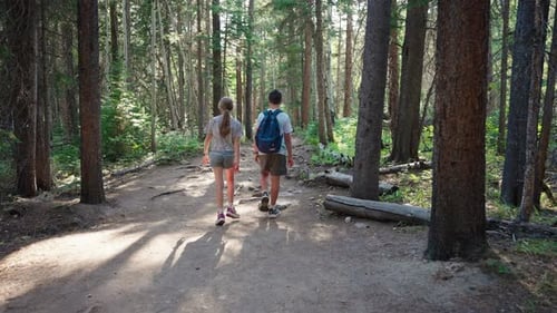 Boy And Girl Walk Together Exploring Nature Wilderness