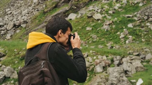 Man Photographs Rocky Mountain Landscape