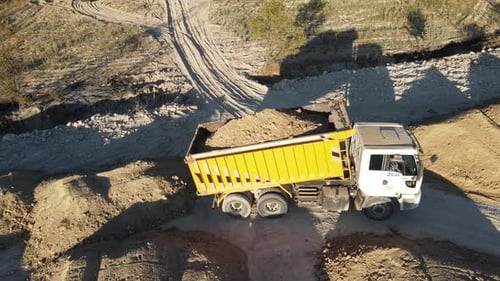 Aerial View of Dump Truck Unloading Soil