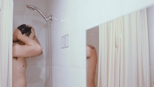 Man Washing Hair in Shower