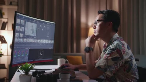Young Adult Working at Computer in Wheelchair