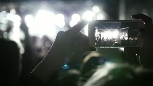 Concert Seen Through a Phone at Night