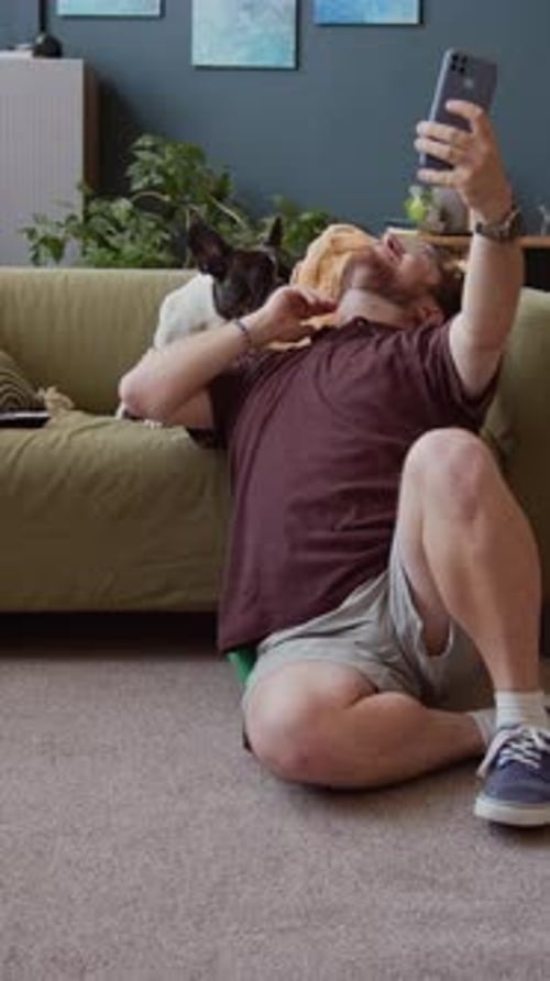 Man Takes Selfie with His Dog Indoors