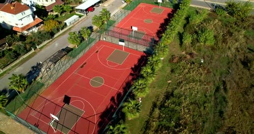 Aerial View of Basketball Court on Sunny Summer Day in a Small European Area