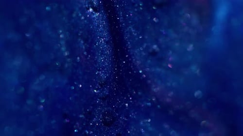 Abstract Blue Liquid with Shimmering Iridescent Particles