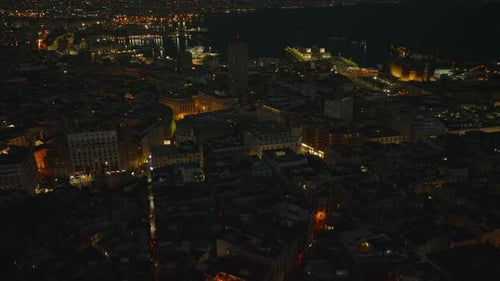 High Angle View of Urban Borough with Illuminated Streets Glowing on Buildings