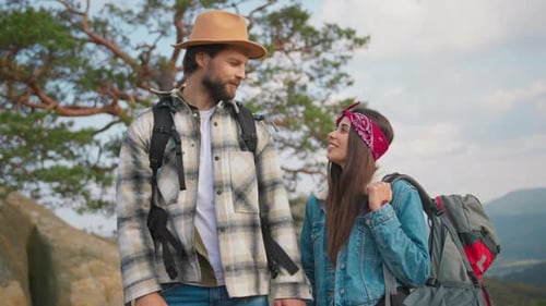 Couple Enjoying Mountain View While Hiking