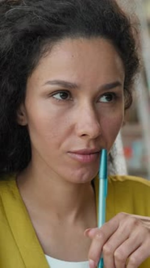 Latina Arabian Hispanic Thoughtful Woman Thinking Idea Insight Pen in Library Smiling Female Girl