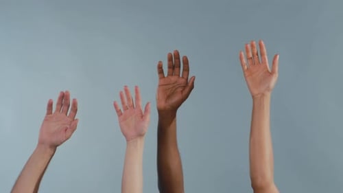 Mixed Group of Individuals Enthusiastically Raises Their Hands to Support Civic Engagement and