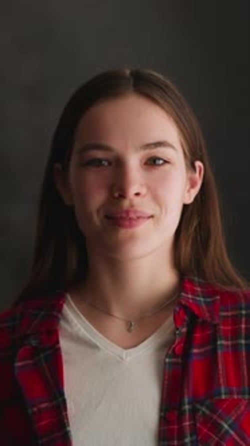 Smiling Young Woman in Plaid Shirt Close Up