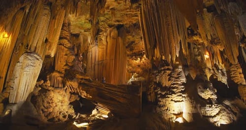 Couple exploring stalactites and stalagmites at the luray caverns in Virginia