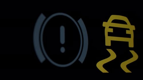 Illuminated Car Dashboard Warning Light Close Up