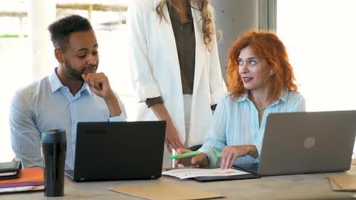 Diverse Team Collaborating in Modern Office Workplace