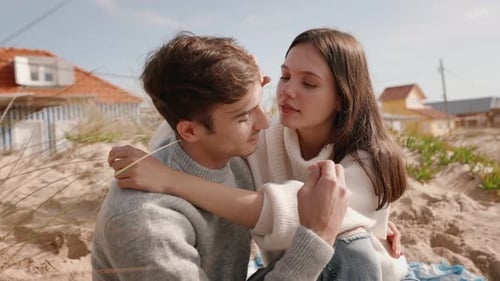 Romantic Couple Embracing on Beach Dunes at Summer