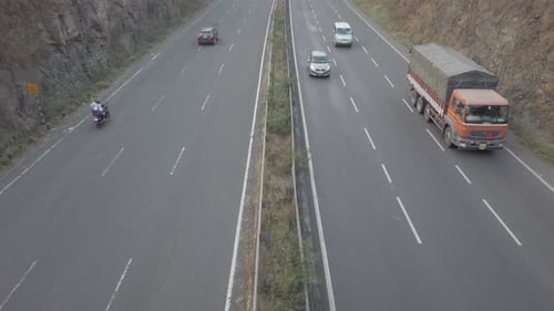 Multi-lane Mumbai Bangalore highway traffic near Pune, road travel in India
