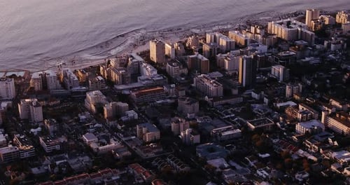 4k drone footage of a city along the coast
