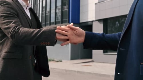 Two Business Man Friendly Meeting Clapping Hands and Fist Greeting Together Downtown Street Closeup